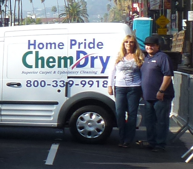 Bill Sachs and Kathryn Mills pose in front of one of their Home Pride Chem-Dry vans. Bill expects to save up to $2,500 a month thanks to Chem-Dry's latest technology.