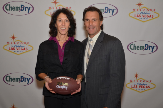 Debbie Purcell poses for a photo with football great Doug Flutie during Chem-Dry's annual convention, held in February 2013 in Las Vegas.