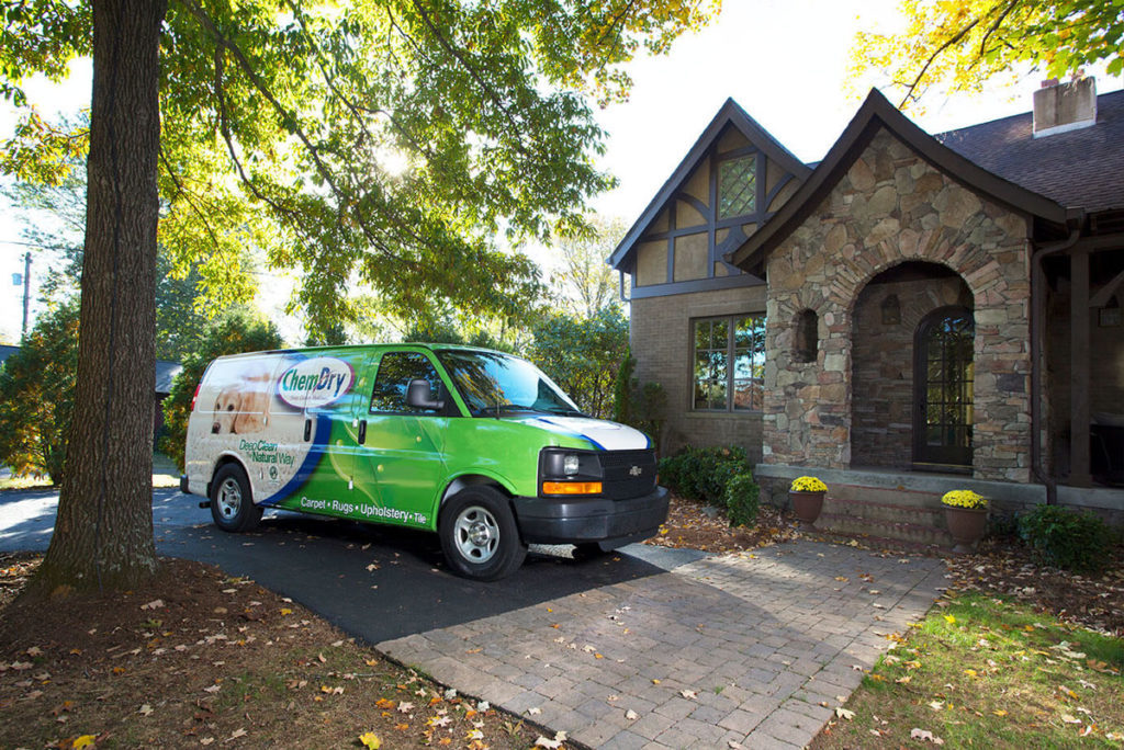Buy a carpet cleaning franchise with Chem-Dry franchise van in front of house