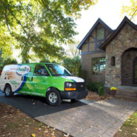 Chem-Dry franchise van in front of house